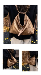 Detail of vintage brown tote bag with metallic texture and brass buckles on shoulder strap