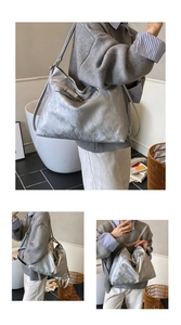 Close-up of the silver wrinkled metallic texture and sleek finish on a large tote bag
