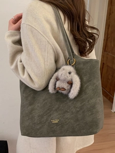 Retro deep green large capacity tote bag with long shoulder straps and plush charm