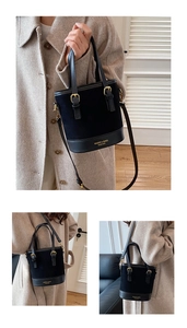 Detail showing contrast textures and gold hardware of the vintage bucket bag