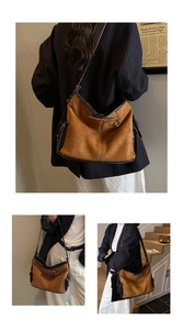 Detail of vintage brown suede tote bag featuring contrast leather trim and stitching