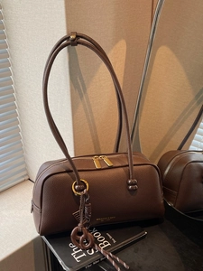 Vintage dark brown pebble leather bowling bag with long handles and metallic zipper