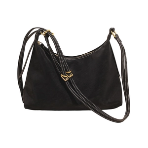 Black suede crescent hobo bag with contrast white stitching and gold hardware buckle