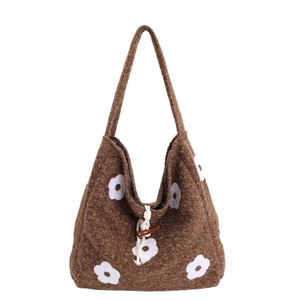Brown plush tote bag with white floral embroidery and toggle closure detail