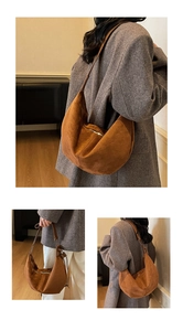 Detail of caramel hobo bag with suede texture and crescent design for daily commute