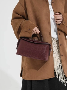 Burgundy leopard pattern shoulder bag with top handle and spacious interior for women
