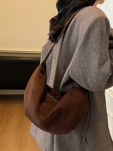 Vintage dark brown suede hobo bag with crescent shape and stylish side tie details