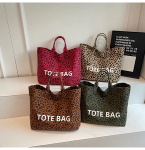 Collection of four leopard print canvas tote bags in red, sand, brown and green