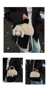 Close-up of cream fuzzy plush bag with cute rabbit pendant and adjustable leather strap