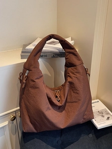 Brown minimalist nylon tote bag with wide straps and large capacity for casual commuting