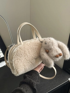 Winter plush crossbody bag in cream faux fur with long-eared rabbit charm and shoulder strap