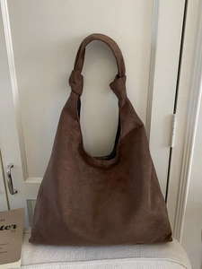 Deep brown suede tote bag with knot handle detail for women commuting daily