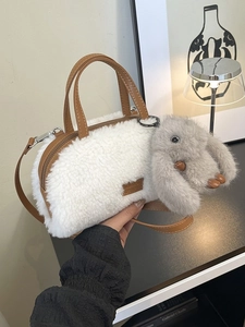 Winter plush barrel bag in white with brown straps and a cute grey rabbit charm