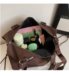 Interior view of large brown travel tote bag showing spacious capacity for daily essentials