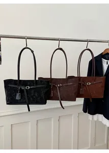 Detailed display of large minimalist tote bags in black, coffee, and brown red colors