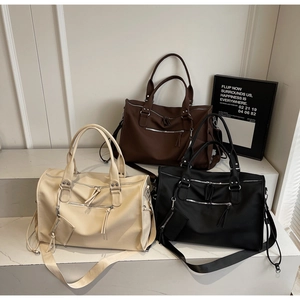 Three large travel tote bags in beige brown and black colors with matching mini pouches