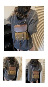 Close-up of olive green retro backpack with white hand-stitching and golden H-buckles