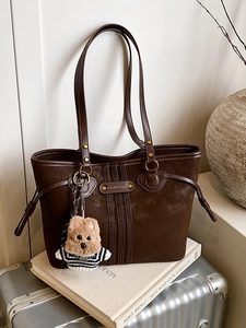 Retro brown suede tote bag with leather straps and cute bear charm for daily commute
