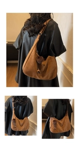 Detail of vintage brown suede hobo bag with plush ball tassel and wooden bead decor