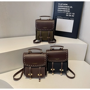 Three retro PU leather mini backpacks in brown and coffee tones with white stitching detail