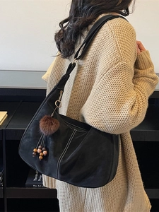 Retro black oversized hobo shoulder bag with white contrast stitching and charm