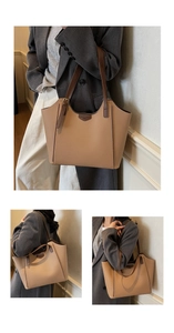Detail view of large lychee grain leather tote bag with stylish brown contrast straps