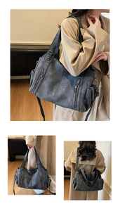 Detail view of large grey vintage tote bag showing side pockets and textured material