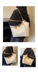 Detail of cream tote bag featuring lychee texture and brown contrast straps