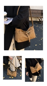 Detail view of camel hobo bag showing litchi texture leather and golden square buckle