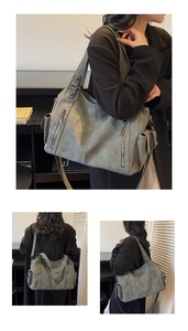 Detail showing the vintage matte leather texture and vertical zipper of the large tote bag