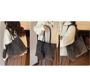Detail view of large grey tote bag set with matching mini pouch and slim shoulder straps