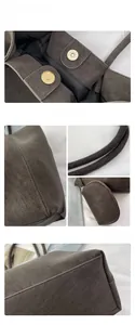 Detail view of large brown tote bag with magnetic clasp, fine stitching, and coin purse