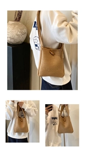 Detailed close-up of knitted crossbody bag featuring a natural wood toggle closure