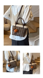 Detail view of plaid tweed bucket bag with white faux fur trim and orange pompom charm