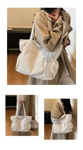 Detail of large corduroy tote bag with front zipper pocket and drawstring side pouches