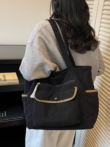 Large black corduroy tote bag with khaki trim and multi-pockets for stylish daily commuting