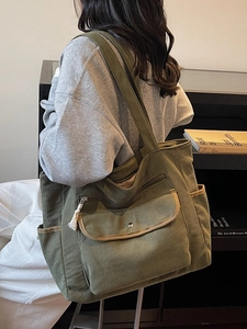 Olive green corduroy tote bag for women showing a large capacity and wide shoulder strap