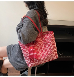 Detail of red and white jacquard tote bag with traditional pattern and silk scarf