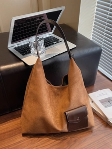 Brown frosted leather tote bag for women shown in a cozy home office setting