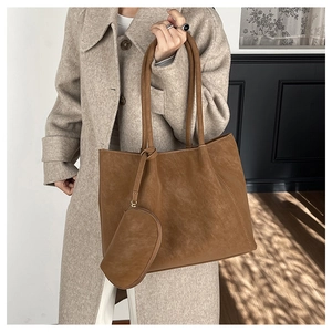 Brown faux suede tote bag detail with small coin pouch accessory on handle