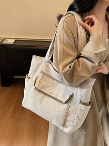 Large beige corduroy tote bag with dark brown trim for casual daily commuting