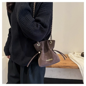 Close-up of the vintage frosted bucket bag with gold chain strap and drawstring closure