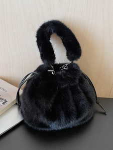 Stylish black faux fur bucket bag with soft drawstring closure for autumn and winter