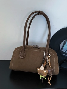 Vintage brown suede Boston bag with contrast stitching and cute bear charm pendant