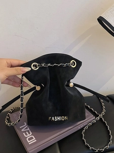 Frosted black suede bucket bag with gold chain strap and drawstring closure