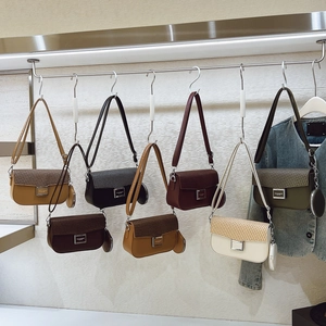 Detail showing multi-color woven flap crossbody bags with matching round coin purses