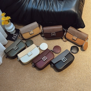 Detail of color-block crossbody bags with woven texture flap and mini pendant coin purse