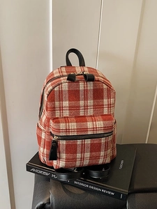 Retro vintage plaid tweed backpack with orange-red pattern and front zip pocket