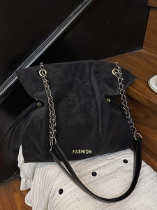 Retro black bucket bag with frosted leather texture and gold chain strap for women