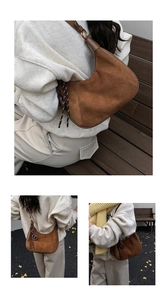 Dettaglio della borsa hobo in camoscio marrone con anello in metallo e nappe intrecciate